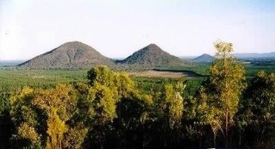 Glass House Mountains The twins as they are called here... Could they be GIGANTIC twin barrows, note the pyramid shape and also a third pyrmind in the background.jpg