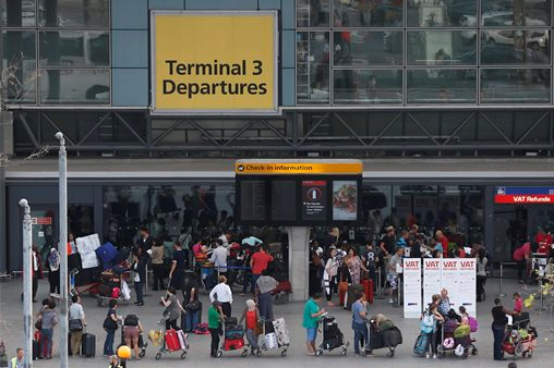 Passengers queue outside Terminal 3 at Heathrow Airport in London Friday, July 12 2013 AP Photo Sang Tan.png