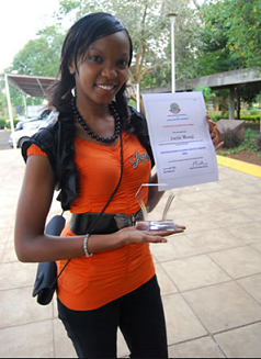 Cecilia Mwangi holding Service award for Youngest Distinguished Alumni of JKUAT on 9th May 2009.png