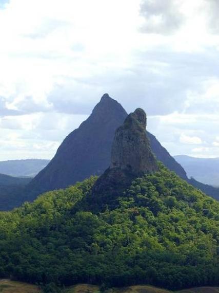 Glass House Mountains Coonowrin or crookneck with Beerwah the mother behind we have to remember this area was hit by a MASSIVE Tidal Wave according to the Aboriginals. Now the Government is trying to say it was a storm HA....jpg