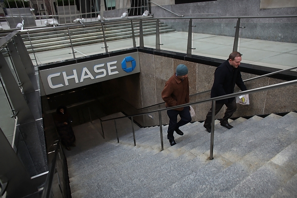 People exit a Chase branch at the company's Manhattan headquarters..png